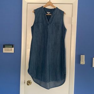 Sleeveless denim shirt dress with front patch pockets and mandarin style collar